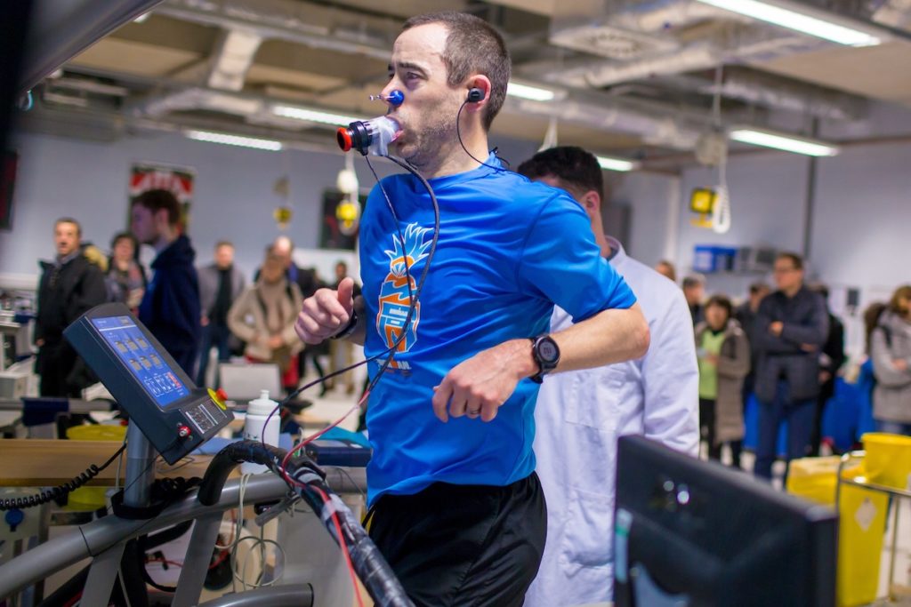 A man on a treadmill having his breathing monitored by sports scientists from Liverpool John Moores University.