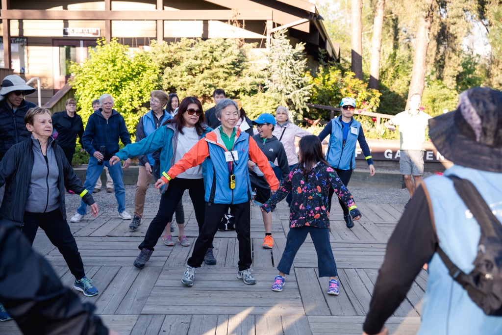 Residents warming up for a community walk.